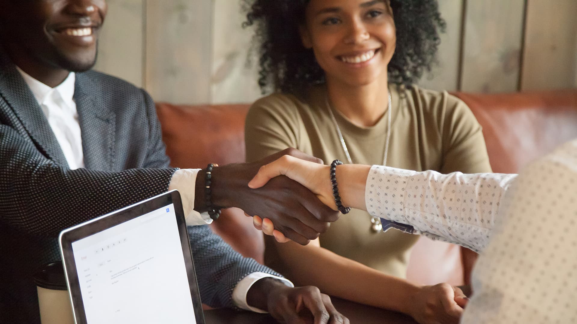 A contractor meets with clients in an office setting
